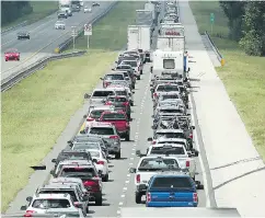  ?? STEPHEN M. DOWELL / ORLANDO SENTINEL VIA THE ASSOCIATED PRESS ?? Traffic crawls northbound on Florida’s Turnpike as people evacuate before the arrival of Hurricane Irma.