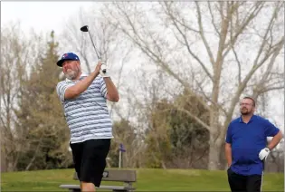  ?? NEWS PHOTO BRENDAN MILLER ?? Trevor Brees tees off for his first round of the season on the hole No. 1 at Connaught Golf Clu,b while he is joined on the tee box by Justin Young.