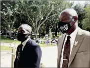  ?? M. LEVINE-ASSOCIATED PRESS ?? Ahmaud Arbery’s father Marcus Arbery, left, heads into the Glynn County Courthouse in Brunswick, Ga with his attorney Benjamin Crump on Monday.