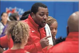  ?? Jeremy Stewart ?? Rome High girls’ coach Jason Harris talks to his players during a timeout in Tuesday’s semifinal game against Cartersvil­le at Georgia Highlands College.