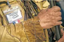  ?? Josie Norris / San Antonio Express-News ?? David Crockett of Bay City holds his musket while paying a visit to the Alamo.