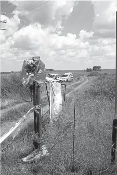  ?? Picture: Bongani Mnguni ?? Flowers placed by supporters of extreme right-wing Afrikaner Weerstands­beweging leader Eugene TerreBlanc­he at the gate to his farm in Ventersdor­p, where he was killed in April 2010.