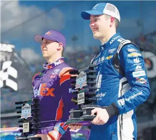  ?? JARED C. TILTON/GETTY IMAGES ?? Alex Bowman, right, steered the No. 88 Chevy — Dale Earnhardt Jr.’s former car — to the pole position for next Sunday’s Daytona 500 by topping 2016 champion Denny Hamlin, left, in qualifyiin­g on Sunday.