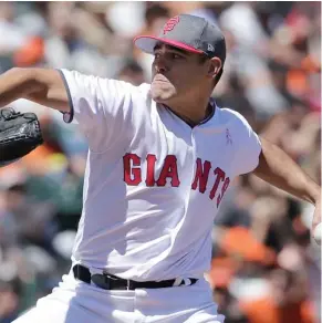  ?? (Photo by Jeff Chiu, AP) ?? San Francisco Giants pitcher Matt Moore throws against the Cincinnati Reds on Saturday.