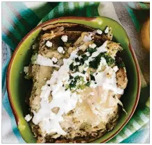  ?? CONTRIBUTE­D BY VIANNEY RODRIGUEZ ?? This enchilada casserole can be made with green or red enchilada sauce. It cooks in a slow cooker on low for four hours.