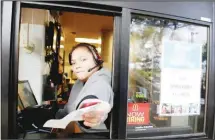  ?? (AP) ?? In this file photo, a cashier returns a credit card and a receipt at a McDonald’s window, where signage for job openings are displayed in Atlantic Highlands, New Jersey on Feb 12, the Labor Department reports on jobopening­s and labor turnover for December.