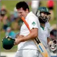  ??  ?? South Africa's captain Graeme Smith (L) embraces Hashim Amla (R) after winning by nine wickets on day three of the second internatio­nal cricket test match against New Zealand in Hamilton, March 17, 2012. REUTERS