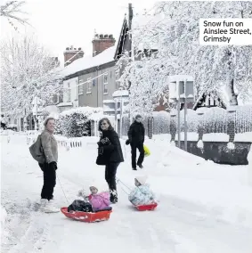  ??  ?? Snow fun on Ainslee Street, Grimsby