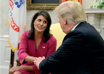  ?? AP ?? President Donald Trump meets outgoing US Ambassador to the United Nations Nikki Haley in the Oval Office of the White House, in Washington, yesterday.