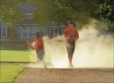  ?? JOHN BREWER - ONEIDA DAILY DISPATCH ?? Sherrill Post 230’s Tyler Rotach asks for time after driving in the game-tying run in the bottom of the seventh against Smith Post at Noyes Park on Tuesday, June 12.