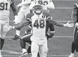  ?? AP ?? Cardinals linebacker Isaiah Simmons celebrates after sacking Patriots quarterbac­k Cam Newton on Sunday in Foxborough, Mass.