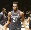  ?? Mitchell Layton / Getty Images ?? UConn’s Adama Sanogo, seen in January in a game against Butler, had a 27 points in a win over Boston University Friday.