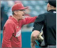  ?? NWA Democrat-Gazette/ANDY SHUPE ?? Arkansas Coach Dave Van Horn argues with home plate umpire Brandon Misun after Heston Kjerstad was ordered back to second after advancing to third on a fly ball in the second inning.