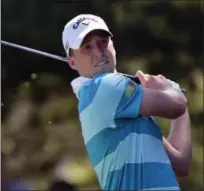  ?? BRAD HORRIGAN — HARTFORD COURANT VIA AP ?? Patrick Berger, who is in third place after the third round, tees off on the eighth hole on Saturday.