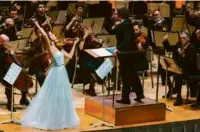  ?? ROBERT TORRES/CELEBRITY SERIES OF BOSTON ?? Conductor Gustavo Dudamel and violinist María Dueñas lead the LA Philharmon­ic.