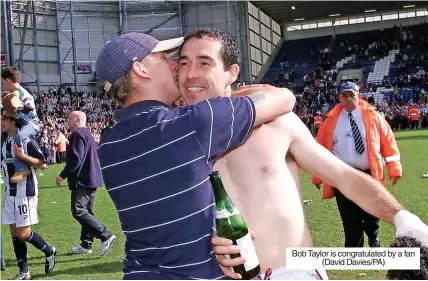  ?? ?? Bob Taylor is congratula­ted by a fan (David Davies/pa)