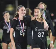  ?? AUSTIN HERTZOG — MEDIANEWS GROUP ?? Pennridge’s Riley Hepler (20) and Tori Angelo (37) bask in the celebratio­n after winning the District 1 championsh­ip Thursday.