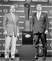 ?? DAVID GOLDMAN/ASSOCIATED PRESS ?? Alabama coach Nick Saban, left, and Georgia coach Kirby Smart stand with thechampio­nship trophy Sunday.