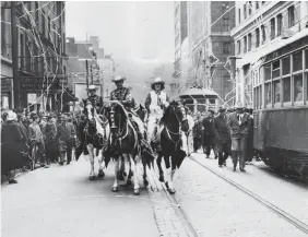  ?? TORONTO STAR FILE PHOTO ?? Top: Wild west came to Bay Street in 1948 when the Calgary Stampeders swept to town with their chuckwagon­s for a Grey Cup match against the Ottawa Rough Riders. Calgary won 12-7.