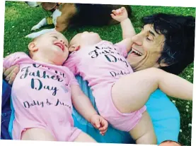  ??  ?? Back in action: Ronnie Wood with his twins, Alice and Gracie