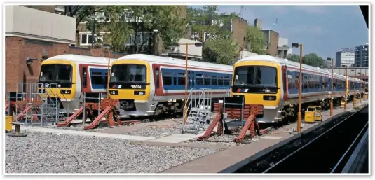 ?? COLOUR RAIL. ?? Class 165s are stabled at London Marylebone on May 19 1992. BR’s Network SouthEast sector focused on a fast rollout of DOO on each of its routes as new stock arrived for suburban services, including the ‘165’ Turbo fleet built for the Thames and Chiltern Division between 1990-92.