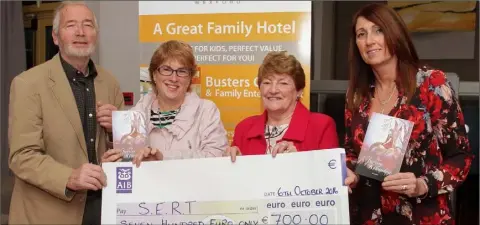  ??  ?? Author Tom Logan from Gibberwell, Duncormick, presents a cheque to SERT for €700 which he raised from sales of his book ‘The Faeries of Kilmokea’. Pictured in the Maldron Hotel: Tom Logan, Niamh Tierney and Catherine Malone of SERT, and Siobhan Logan.