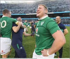  ??  ?? LEFT: Tadhg Furlong with Good Counsel College Deputy Principal Aidan O’Brien; RIGHT: Tadhg celebrates the famous victory against New Zealand at Soldier Field, Chicago.