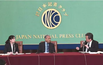  ??  ?? Dr Mahathir (centre) listens on as JNPC chairman Ryosuvke Harada (right) speaks during the dialogue. — Bernama photo