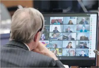  ??  ?? Canadian Members of Parliament are shown on a monitor during a virtual session of the House of Commons on Tuesday.