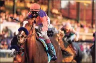  ?? Darron Cummings / Associated Press ?? John Velazquez rides Authentic to win the Breeders’ Cup Classic Saturday in Lexington, Ky.