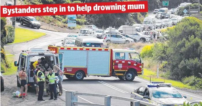  ?? Picture: IAN WALDING ?? WASHED OFF ROCKS: Emergency services on the scene at Stony Creek, near Lorne, after a woman was pulled unconsciou­s from the water yesterday.