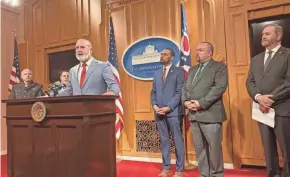  ?? JESSIE BALMERT/COLUMBUS DISPATCH ?? Rep. Bernie Willis, R-springfiel­d, center, and Rep. Josh Williams, R-sylvania Township, third from the right, discuss their bill to increase penalties for repeat gun violence offenders. Ohio Attorney General Dave Yost, far right, supports the bill.