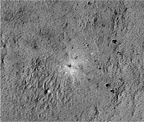  ?? Goddard Space Flight Centre; Antonie Robertson / The National ?? An image of the Moon’s Atlas Crater shows pieces of debris; left, the Rashid rover