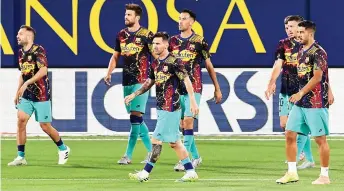  ?? — AFP photo ?? (From left) Barcelona’s defender Jordi Alba, defender Gerard Pique, forward Lionel Messi, midfielder Sergio Busquets, defender Clement Lenglet and forward Luis Suarez arrive to warm up before the Spanish La Liga match against Villarreal at the Madrigal stadium in Villarreal.