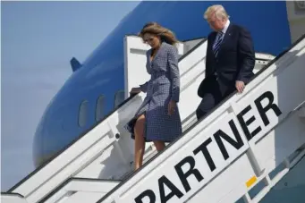  ?? (AFP/Getty) ?? Melania made the headlines last week after swatting her husband's hand away when he reached for hers