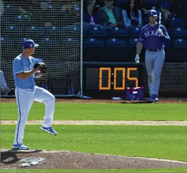  ?? CHARLIE RIEDEL/AP ?? The Royals’ Nick Wittgren throws before a pitch clock runs out in a spring training game against the Rangers in Surprise, Arizona. Between pitches, pitchers have 15 seconds with nobody on base, 20 seconds if there’s a runner.