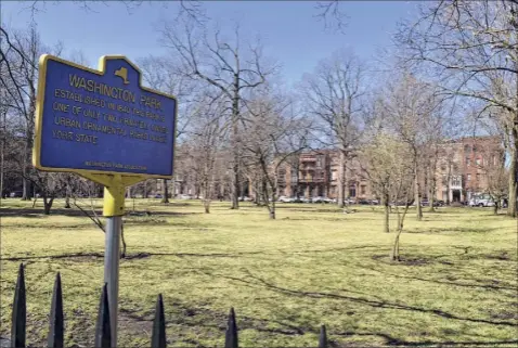  ?? Photos by Will Waldron / Times Union ?? Troy’s Washington Park is seen from Third Street on March 30 in Troy. The park is only one of two privately owned ornamental parks in the state.