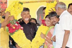  ??  ?? TD activists felicitate Chief Minister N. Chandrabab­u Naidu at the IGMC stadium in Vijayawada on Sunday. Naidu is wearing a black shirt in protest against the Central government neglecting funds to Andhra Pradesh.