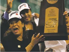  ?? MARY ANN CHASTAIN/ASSOCIATED PRESS FILE PHOTO ?? Coach C. Vivian Stringer holds the trophy after Rutgers defeated Arizona State to win the Greensboro, N.C., regional in the 2007 NCAA Tournament. Along with the Scarlet Knights, Stringer took Cheyney State and Iowa to Final Fours.