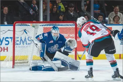  ?? MARISSA BAECKER/Shootthebr­eeze.ca ?? Kelowna Rockets forward Dillon Dube takes a shot on Victoria Royals goaltender Griffen Outhouse during first-period WHL action on Monday afternoon at Prospera Place in Kelowna.The Rockets won 5-4.