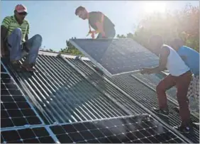  ?? Photo: David Harrison ?? Solution: In the face of rising electricit­y costs and loadsheddi­ng, a home owner in Cape Town is installing solar panels, batteries and an inverter.