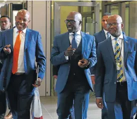  ?? /Esa Alexander/The Times ?? Economic update: South African Reserve Bank Governor Lesetja Kganyago, left, Finance Minister Malusi Gigaba and Treasury director-general Dondo Mogajane ahead of Gigaba’s medium-term budget policy statement in Parliament on Wednesday.