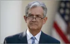  ?? ALEX BRANDON — THE ASSOCIATED PRESS ?? Federal Reserve board member Jerome Powell stands as President Donald Trump announces him as his nominee for the next chairman of the Federal Reserve in the Rose Garden of the White House Thursday.