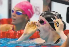  ?? Martin Meissner / Associated Press ?? Alaska high schooler Lydia Jacoby stunned herself by winning the final of the women's 100meter breaststro­ke in Tokyo.