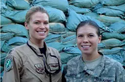  ?? Image courtesy of Staff Sgt. Rachel Martinez for U.S. Air Forces Central Command ?? Amber ( with her sister Kelly Smith when they were both serving in the U.S. Army together in a deployment to Afghanista­n in 2008 right),