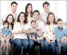  ?? ?? Cikgu Lawa (seated, second left) and Boyce by her side, with their daughters, sons-in-law and grandchild­ren.