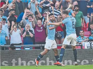  ?? GLYN KIRK/AFP/GETTY IMAGES ?? Man City warmed up for its title defence with a Community Shield win over Chelsea last week.