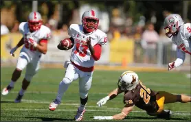  ?? AP PHOTOS ?? New Mexico’s Lamar Jordan (13) runs for a touchdown against the Wyoming during the first quarter of an NCAA college football game, Saturday, in Laramie, Wyo.