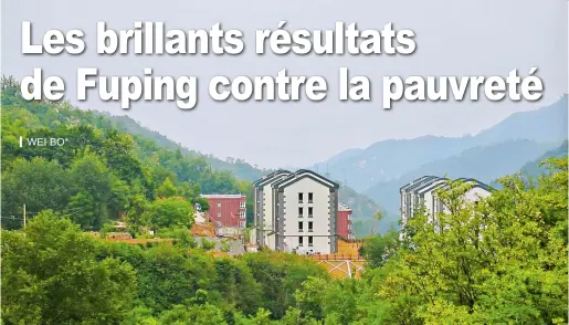  ??  ?? Le village de Loufang au milieu des montagnes verdoyante­s