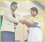  ?? Picture: ANA MADIGIBULI ?? Education Minister, Aseri Radrodro shakes hands with Mahatma Gandhi Memorial High School’s head girl Ulita Raluve Koro at Kshatriya Hall in Suva earlier this month.